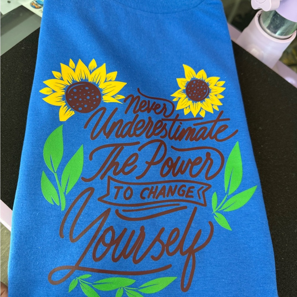 Blue Graphic Tee with Sunflower Design